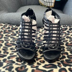 Franco Sarto black leather heeled studded shoe size 8 1/2.  Wear on the heels.